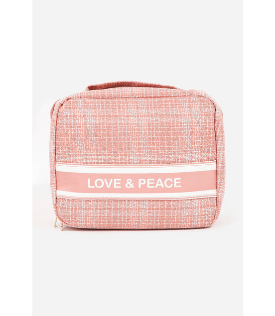 Pink textured bag with 'LOVE & PEACE' text on a white background
