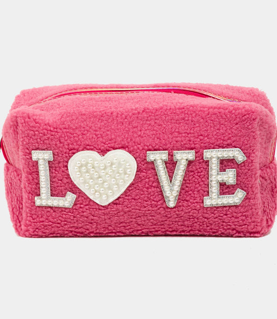 Pink pouch with 'LOVE' text on a white background