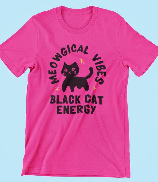 Pink t-shirt with black cat graphic and text on a light blue background