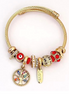 Golden Twisted Bracelet with decorative beads and pearl charms