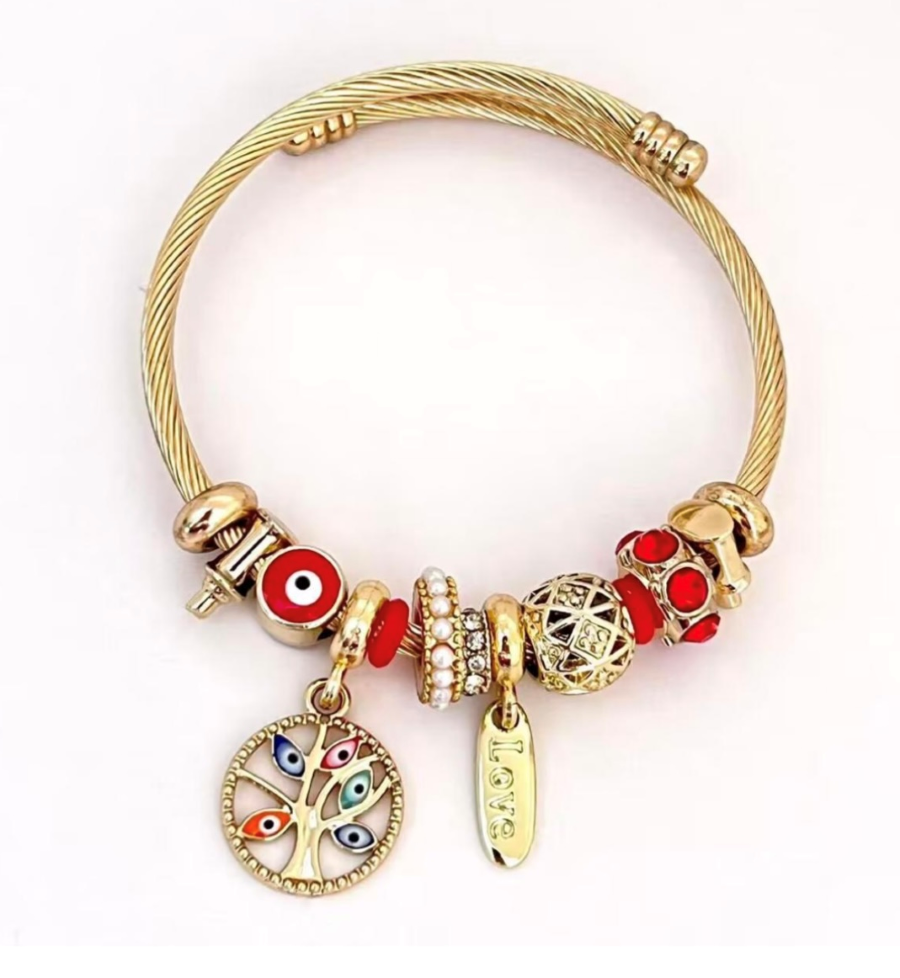 Golden Twisted Bracelet with decorative beads and pearl charms