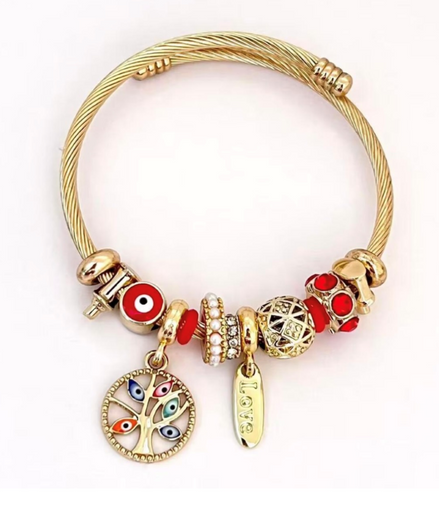 Golden Twisted Bracelet with decorative beads and pearl charms