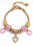 Gold Bracelet with pink crystal bead, heart and pattern shape charms