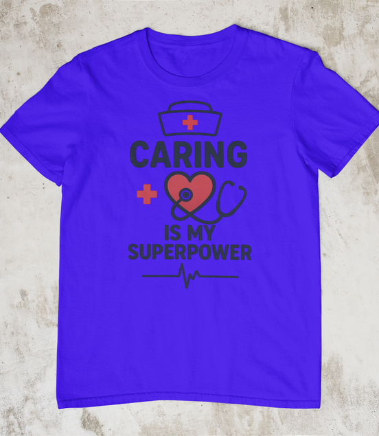 Purple t-shirt with 'Caring is my Superpower' text and graphics on a concrete surface