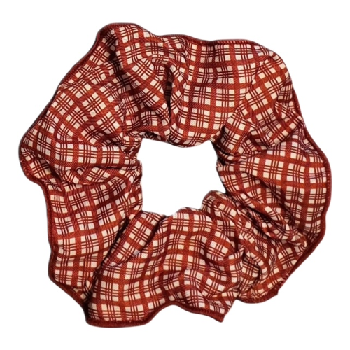 Red and white plaid scrunchie on a white background