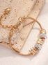 Gold Bracelet with crown and sparkling charms