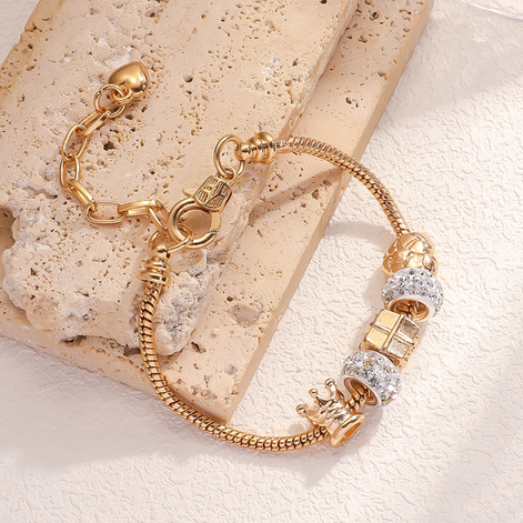 Gold Bracelet with crown and sparkling charms