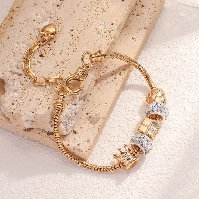 Gold Bracelet with crown and sparkling charms