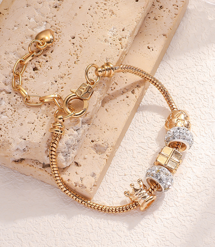 Gold Bracelet with crown and sparkling charms