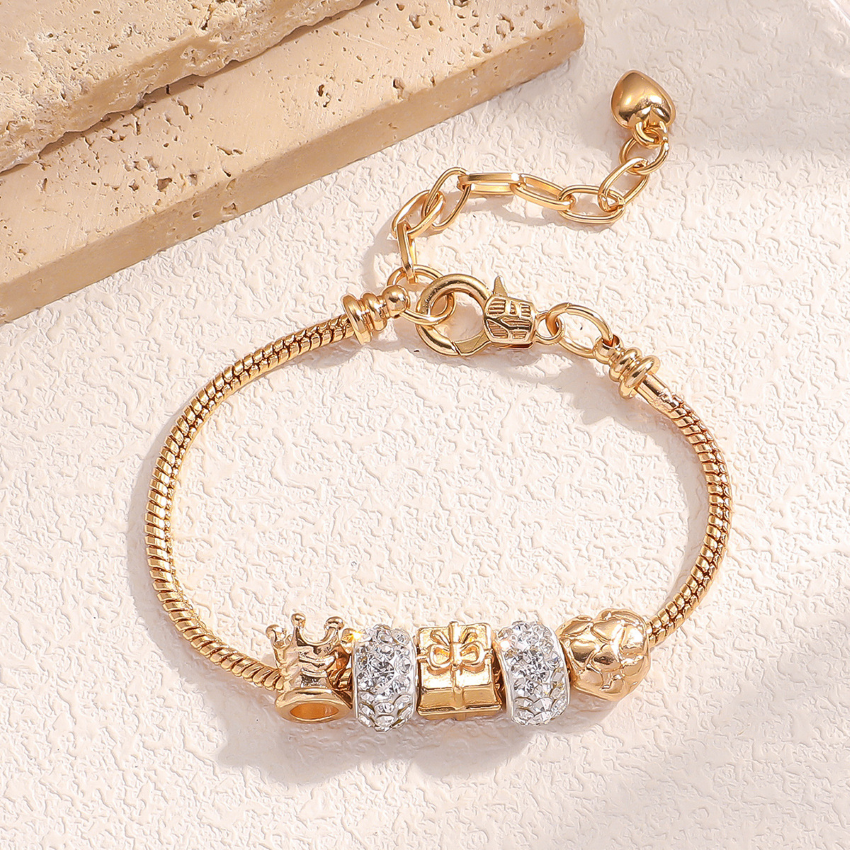 Gold Bracelet with crown and sparkling charms