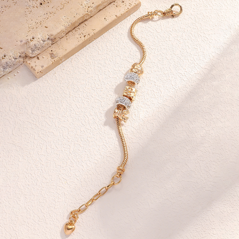 Gold Bracelet with crown and sparkling charms