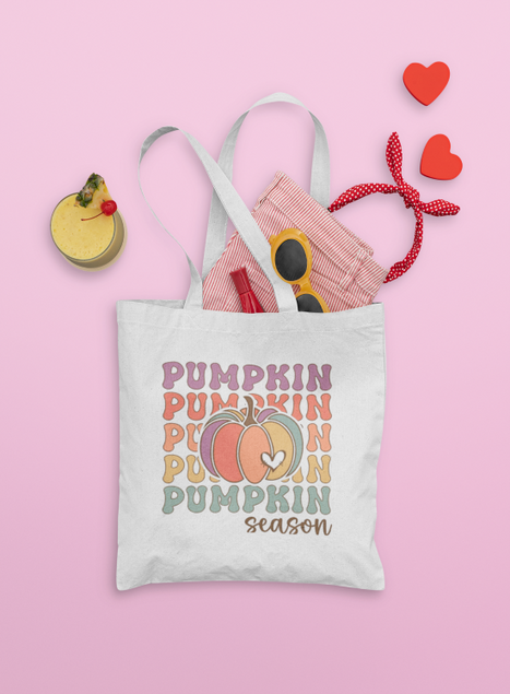 Tote bag with 'Pumpkin Season' text and graphics on a pink background