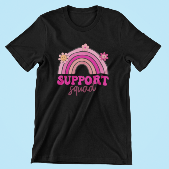 Black t-shirt with a pink rainbow and flowers graphic on a light blue background