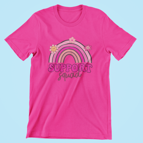 Pink t-shirt with rainbow and 'Support Squad' text on a light blue background