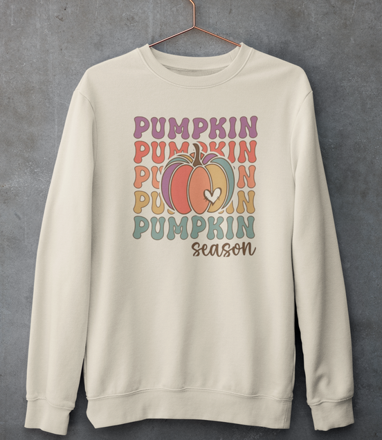 Beige sweatshirt with 'Pumpkin Pumpkin Pumpkin Pumpkin Season' text and pumpkins on a gray background