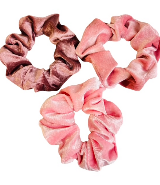 Two pink scrunchies on a white background
