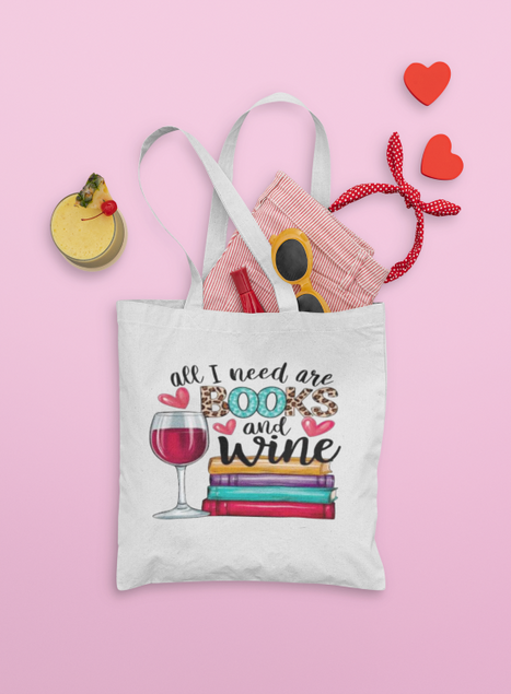 Tote bag with 'All I need are books and wine' design on a pink background