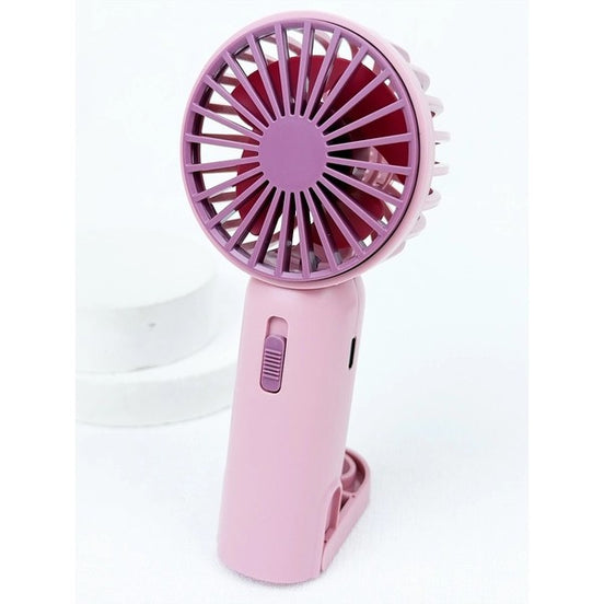 Pink handheld fan with a white background